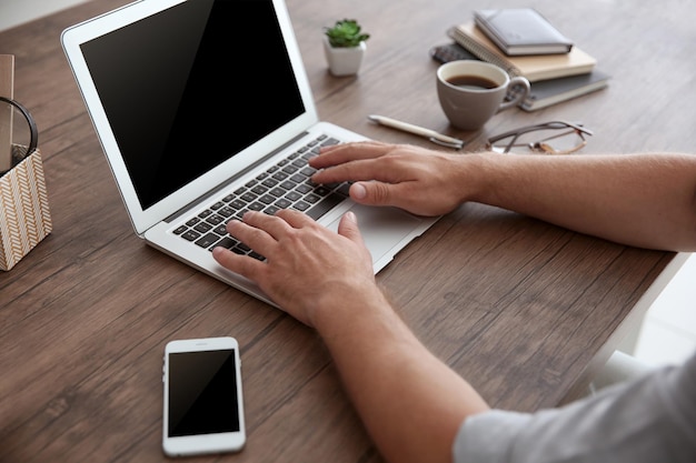 Man working on laptop close up