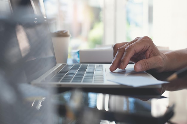 Man working on laptop computer from home office