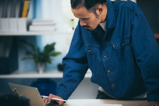 The man working laptop computer from home