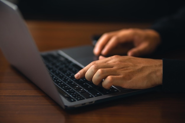 Man working on laptop computer at home