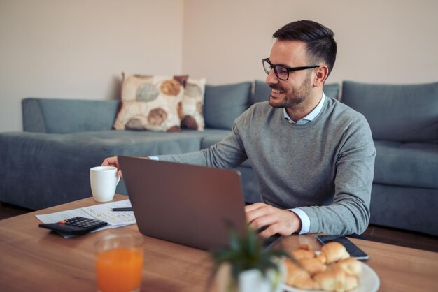 Man working on laptop at home