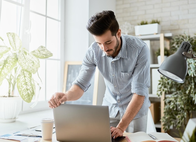 Man working on a laptop at home.