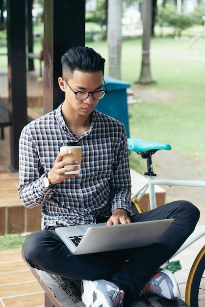 Man Working on Laptop in Park