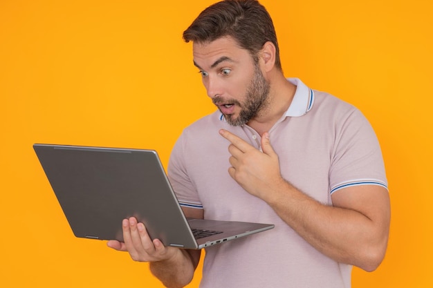 Man working on laptop in studio man checking email on laptop writing message in social network using