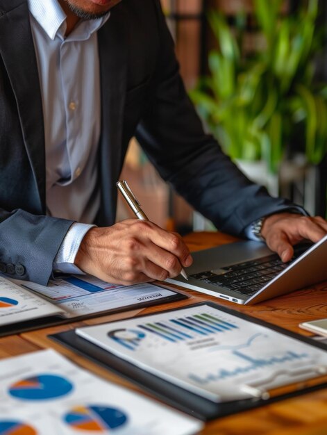 Man Working on Laptop at Table