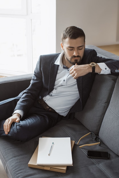 Man Working In Office Doing Notes