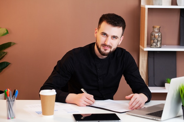 Man working at the office on laptop.