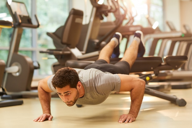 Man Working Out in Gym