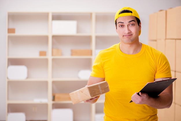 Man working in postal parcel delivery service office