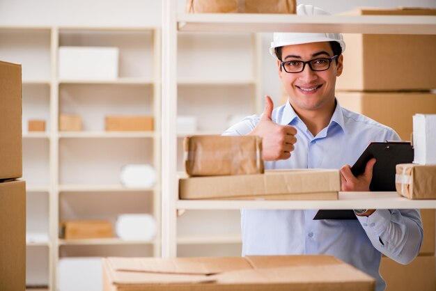 Man working in postal parcel delivery service office