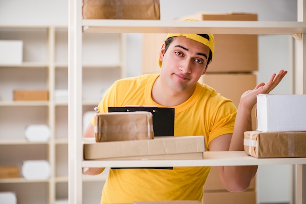 Man working in postal parcel delivery service office