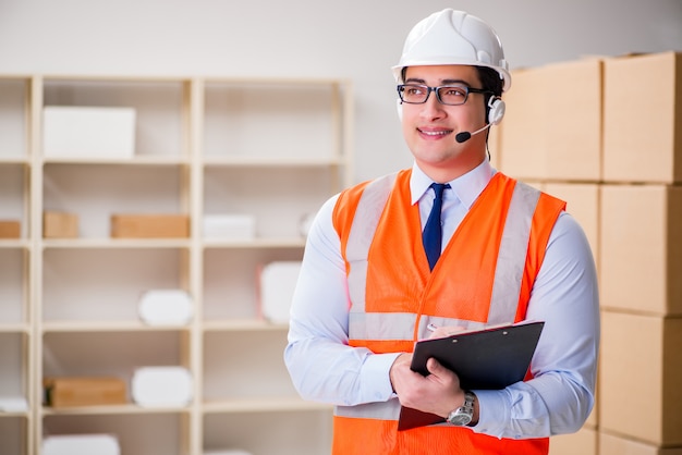 Man working in postal parcel delivery service office