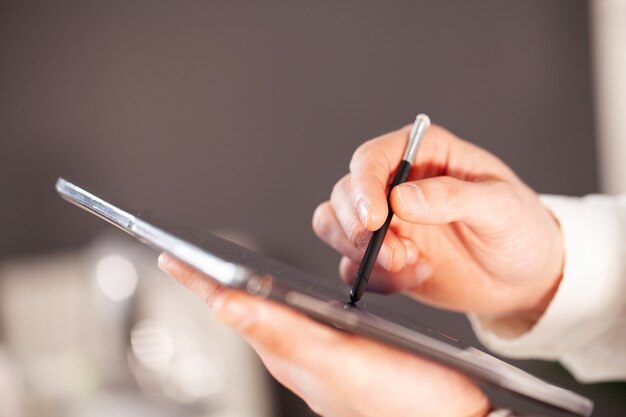 Man working on tablet at company office