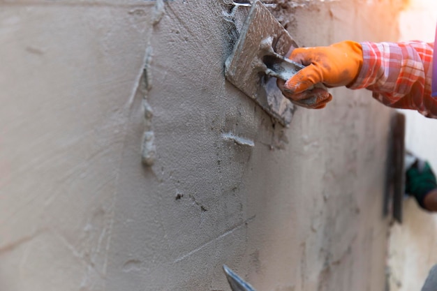 Man working on wall