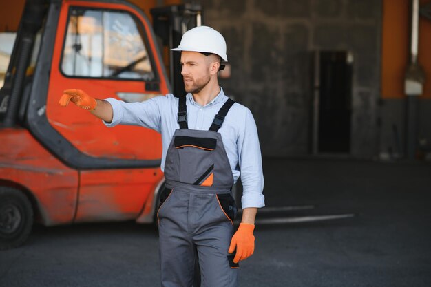 Man working at warehouse and driving forklift