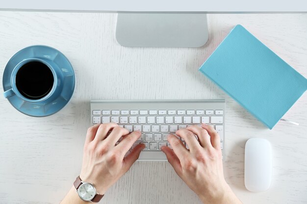 Man working with computer, top view