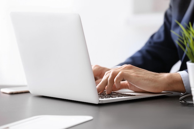 Man working with laptop at table