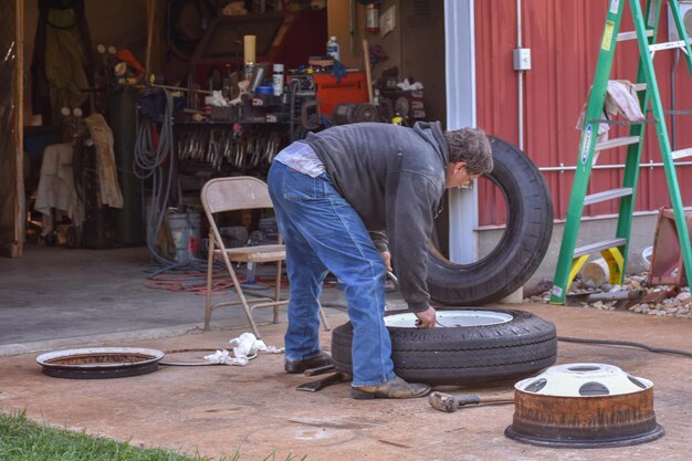 Man working with tire at garage