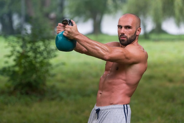 Man During Workout With Kettlebell