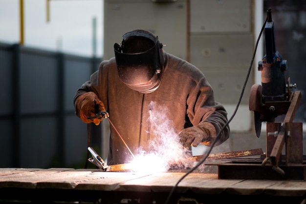 The man works with a welding machine A rare working profession