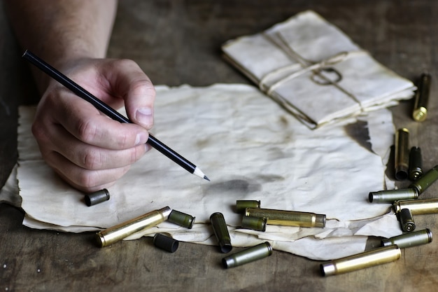 Man write letter retro bullet on the table