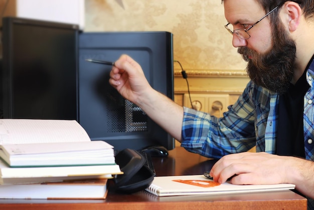 Man write pen table