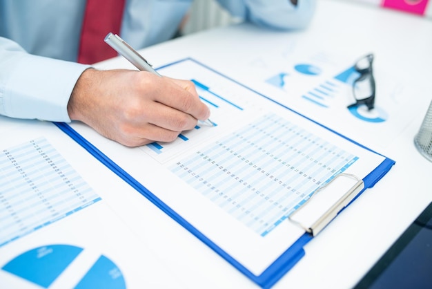 Man writing on a business document