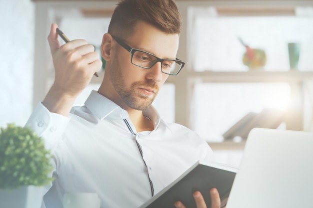 Man writing in organizer