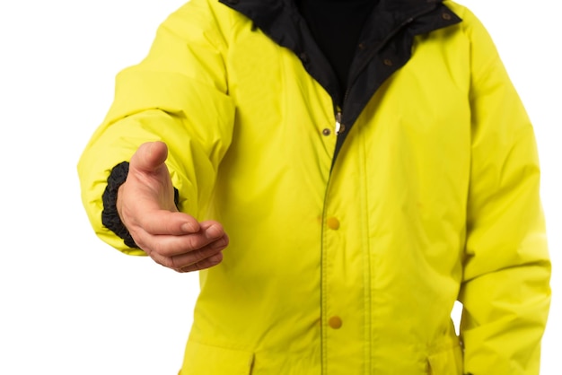 Man in yellow raincoat shaking hands on white background