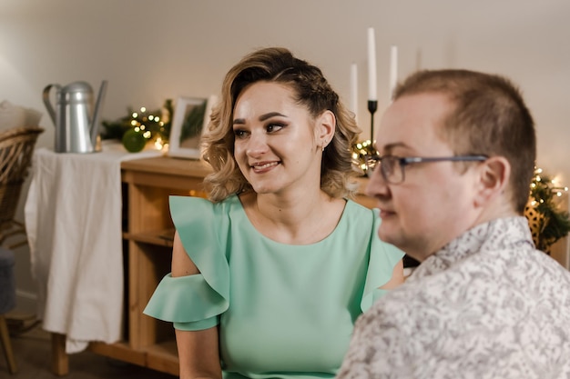 A man and a young woman celebrate christmas