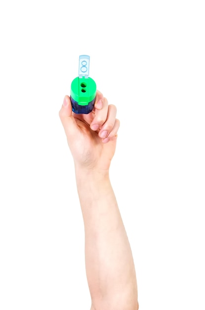 Man39s arm raised holding a office supplies pencil sharpener Isolate on white background