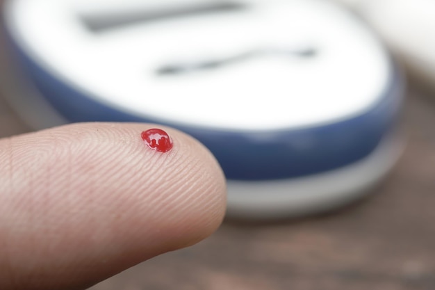 Man39s hand measuring blood sugar level