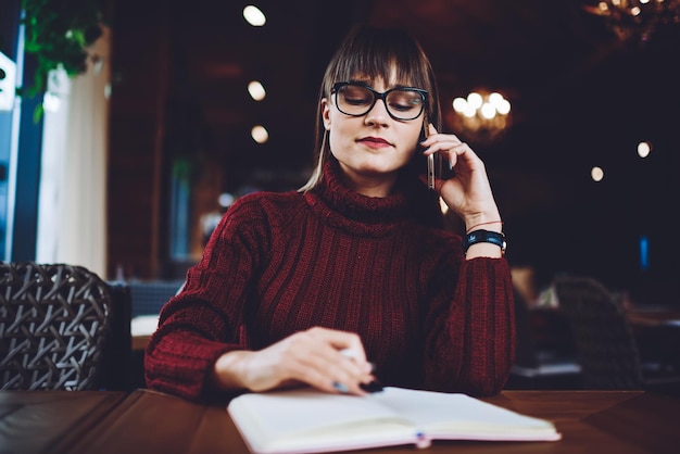 manager of cafeteria in spectacles calling to provider of products for making new order online