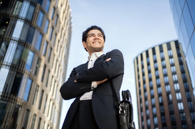 The manager is a positive man going to work in the office in a business suit