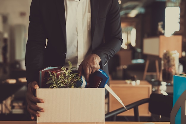 Manager Leaves Workplace With Office Box