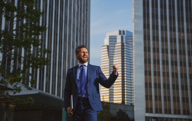 Manager in a luxury modern open space business center successful business man outside