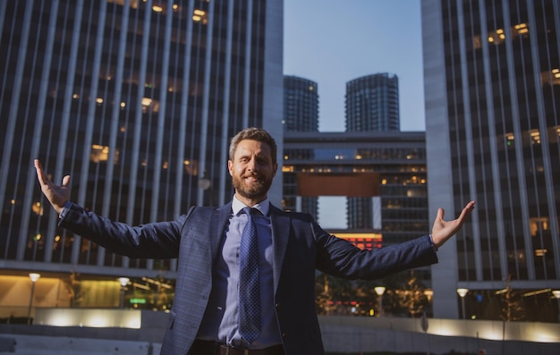 Manager in a modern open space business center successful business man outside