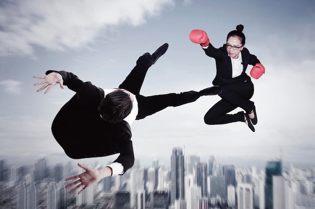 Manager punch rivals while jump above the city