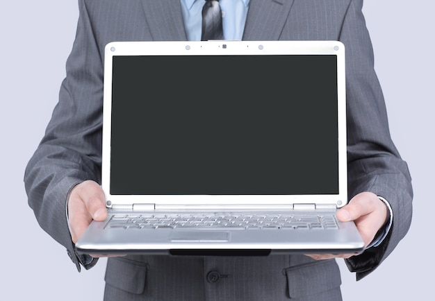 Manager showing open laptop .isolated on white background