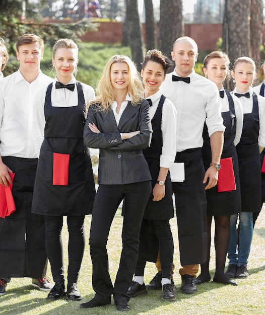 Manager and staff of a modern hotel