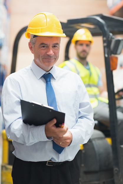 Manager standing in front of his employee