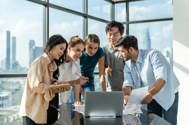 Manager use laptop displayed data analysis while brainstorming ideaTracery