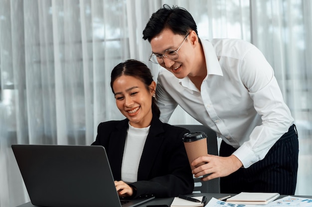 Manager with coffee advice colleagues as concept of harmony in office