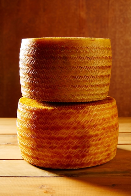 Manchego cheese from Spain on wooden table