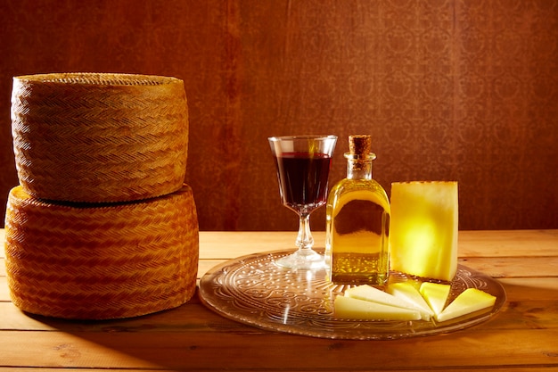 Manchego cheese from Spain on wooden table