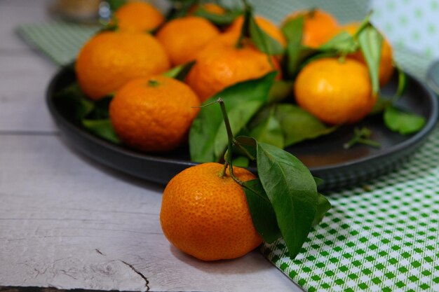 Mandarin orange with selective focus on the tablew