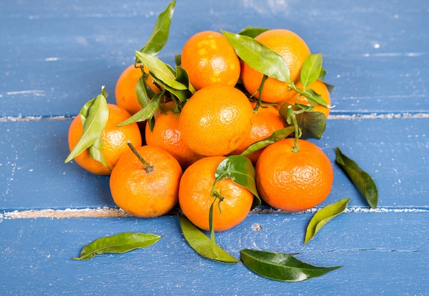 Mandarin oranges on the old blue table