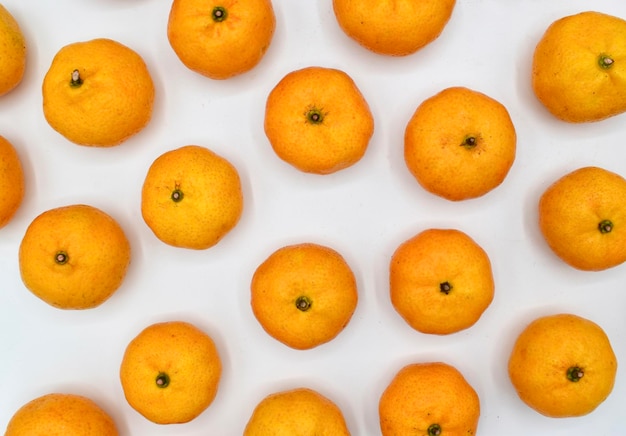 Mandarin oranges scattered isolated on white