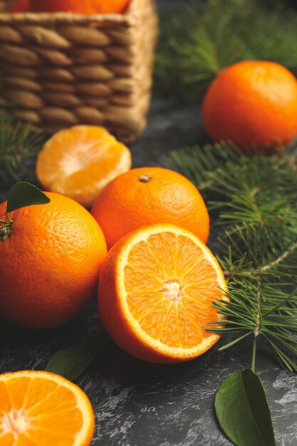 Mandarins, pine branches and basket