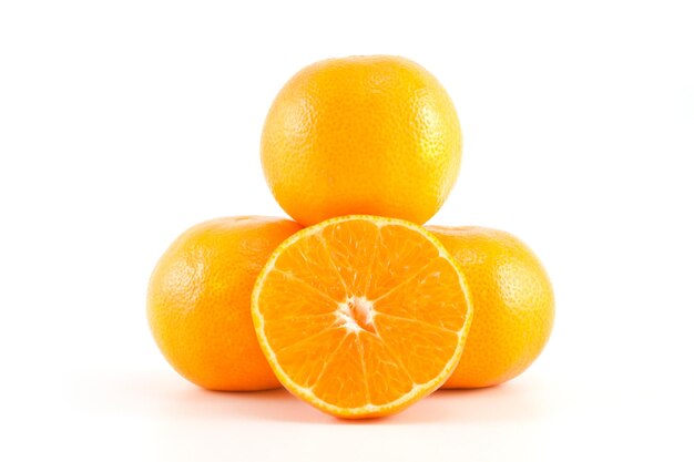 Mandarins or tangerines and a slice on white background